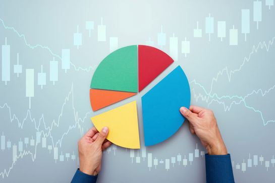 Hands Moving Segments Of Paper Pie Chart